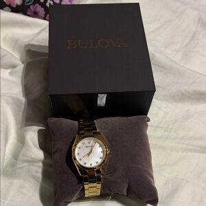 Bulova Gold-Tone Watch with White Dial and diamond hours